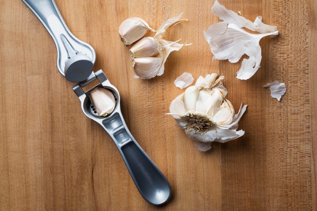Can you use a garlic press without peeling?